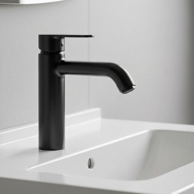Close up of high-end matte black bathroom faucet and white porcelain sink